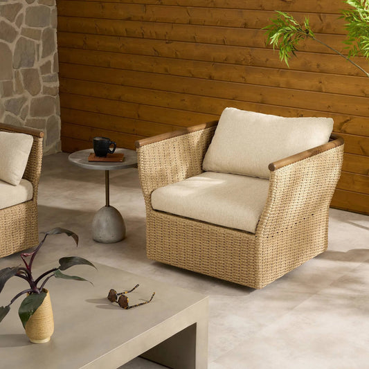 Elmira Outdoor Swivel Chair by Four Hands in ellor beige, stained toasted brown, faux hyacinth. Made from 100% olefin, solid teak, 100% polyethylene in a rustic style.