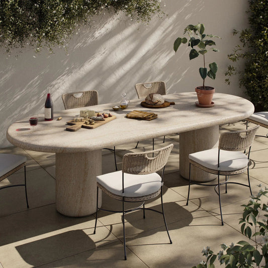 Poole Outdoor Dining Table by Four Hands in textured sand concrete. Made from solid concrete in a transitional style.