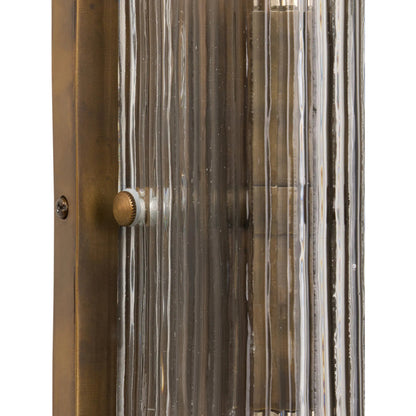 Kenji Sconce by Four Hands in clear reeded glass, burnished brass iron, clear cord. Made from glass, iron, thermoplastic in a traditional style.