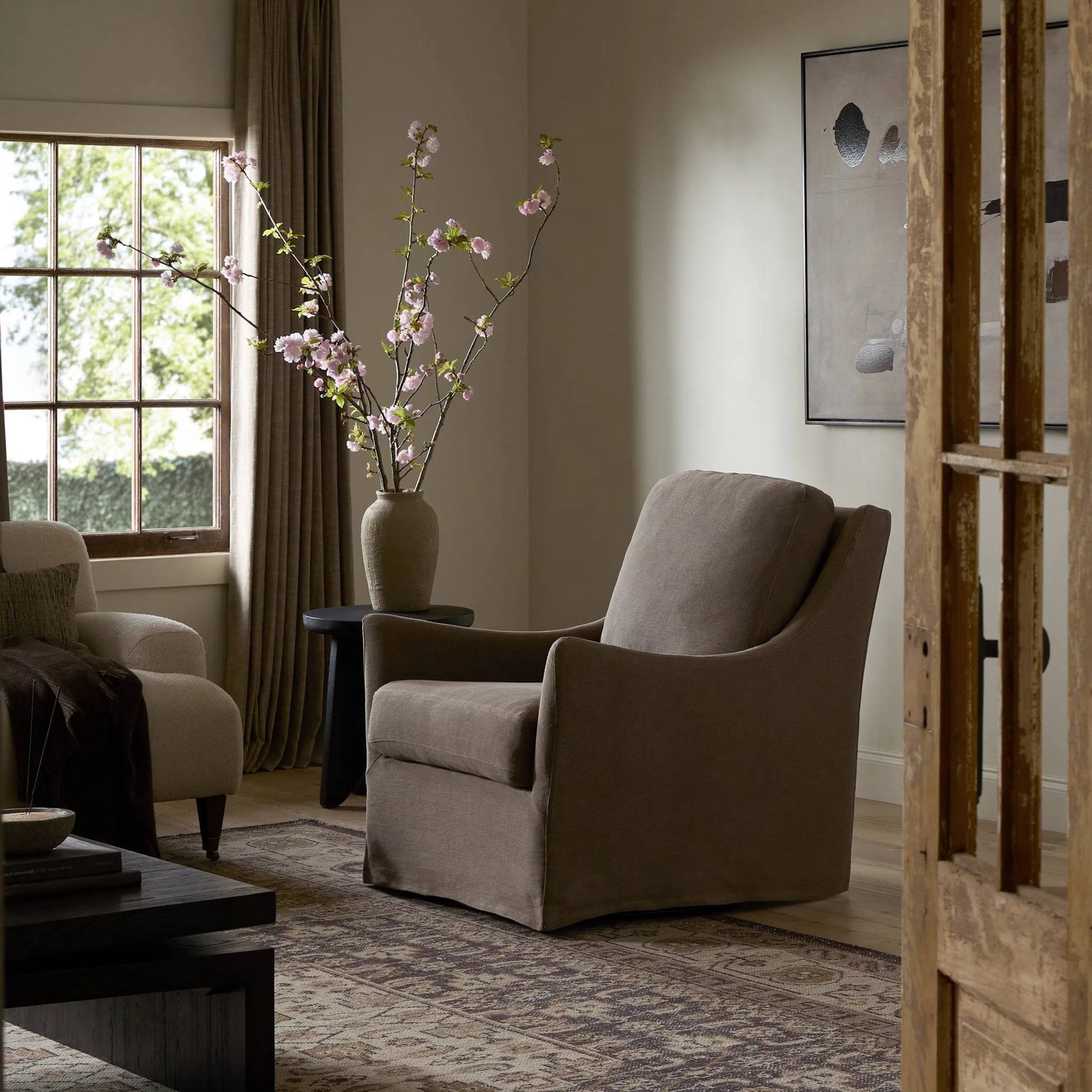 Monette Glider Swivel Chair by Four Hands in broadway coffee. Made from 100% flax/linen in a transitional style.