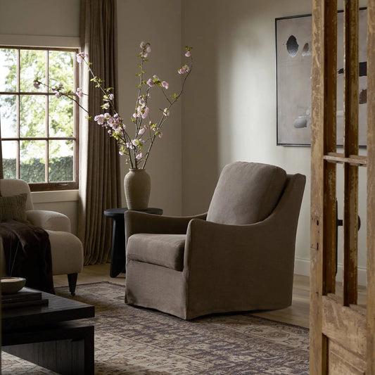 Monette Glider Swivel Chair by Four Hands in broadway coffee. Made from 100% flax/linen in a unique style.