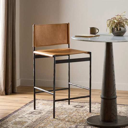 Marlon Counter Stool by Four Hands in sonoma butterscotch, hammered black. Made from top grain leather, iron in a unique style.