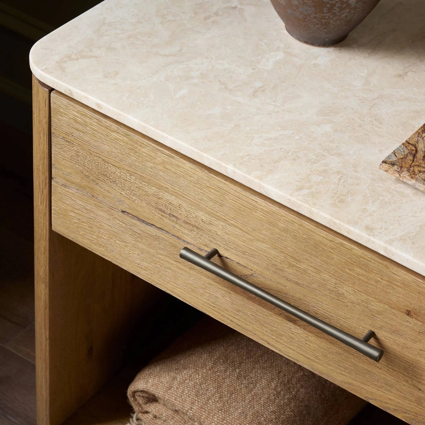 013 SI-2519274 | Closeup | Raleigh Nightstand by Four Hands in cappuccino marble, worn oak veneer. Made from solid marble, thick oak veneer in a transitional style.