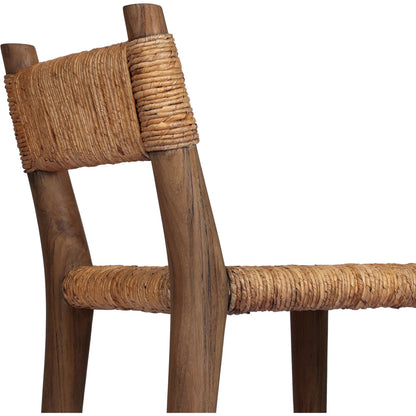 Bovard Dining Chair by Four Hands in stained toasted brown, slight dark bleaching. Made from solid teak, banana leaf in a rustic style.