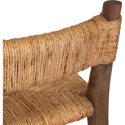 Bovard Dining Chair by Four Hands in stained toasted brown, slight dark bleaching. Made from solid teak, banana leaf in a rustic style.