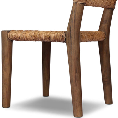 Bovard Dining Chair by Four Hands in stained toasted brown, slight dark bleaching. Made from solid teak, banana leaf in a rustic style.