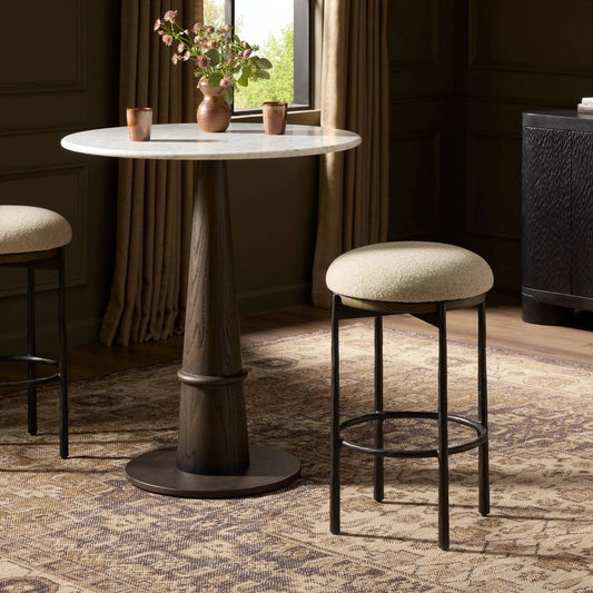 Cofer Swivel Bar Stool by Four Hands in weslie flax, dark hammered iron, brown oak. Made from 100% recycled olefin, iron, solid oak in a unique style.
