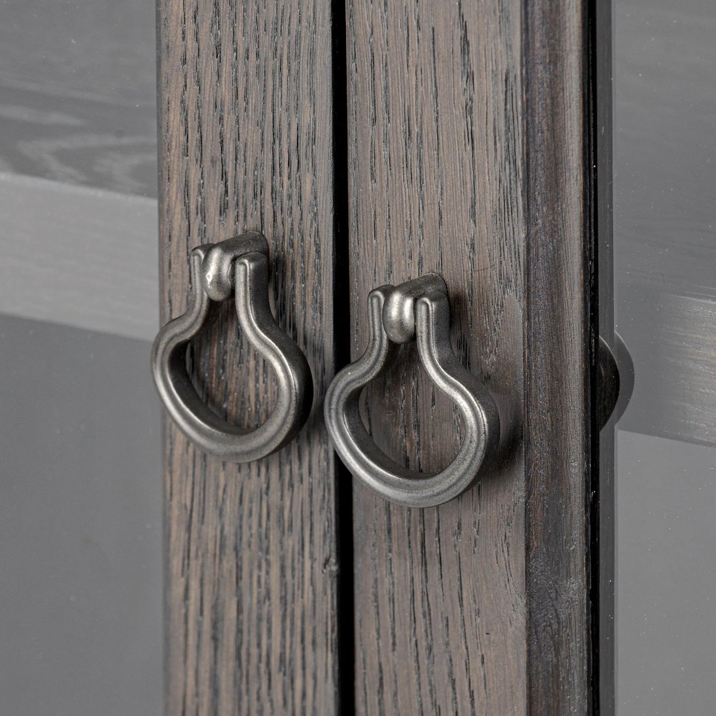 006 SI-2446494 | Closeup | Alden Cabinet by Four Hands in worn black oak veneer, mottled gunmetal. Made from thick oak veneer, solid oak, iron in a traditional style.