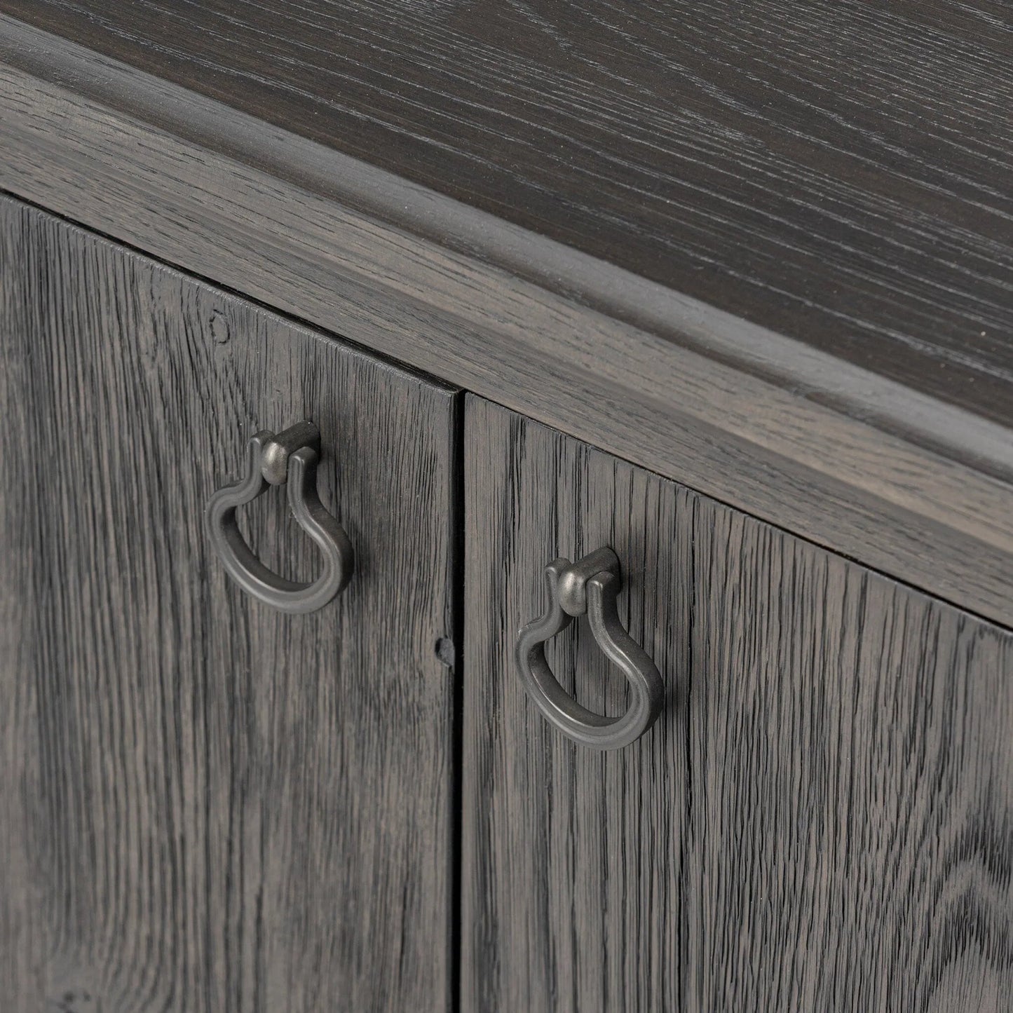 010 SI-2446495 | Closeup | Alden Media Console by Four Hands in worn black oak veneer, mottled gunmetal. Made from thick oak veneer, solid oak, iron in a traditional style.