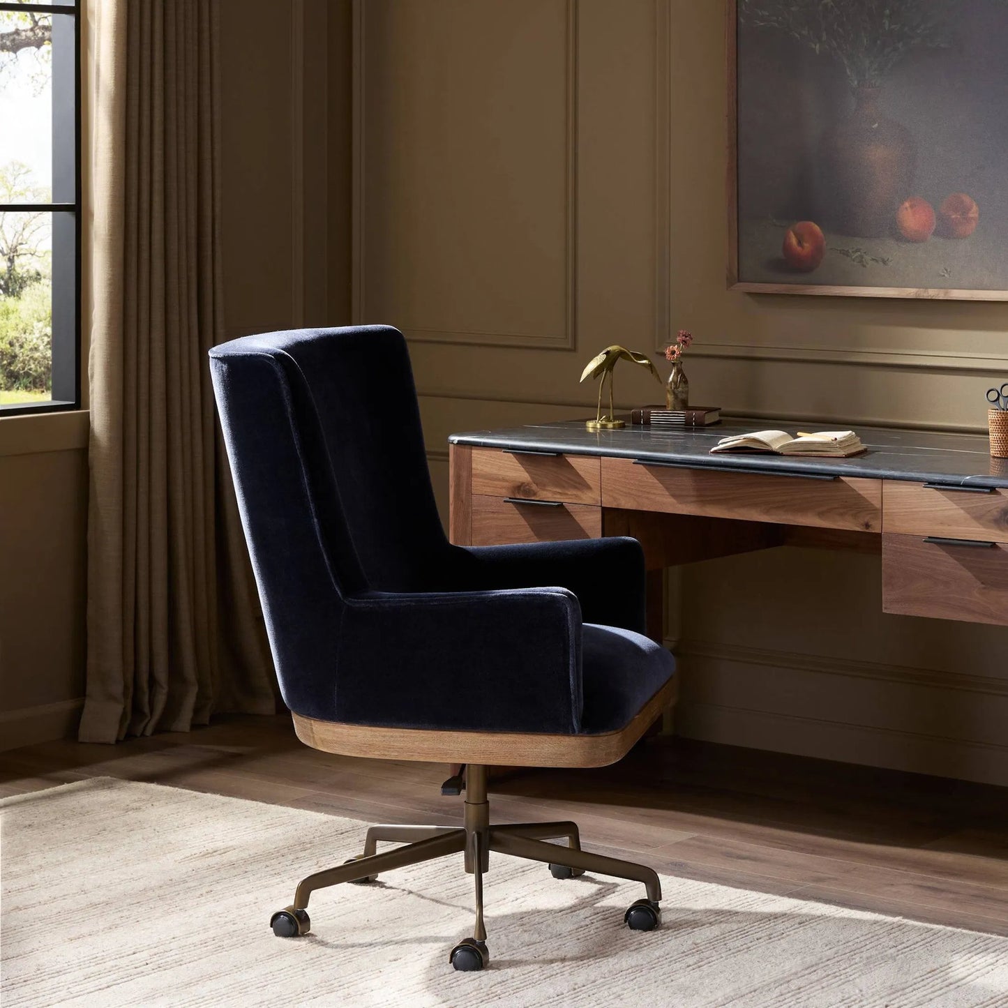 013 SI-2446525 | Lifestyle | Bernardo Desk Chair by Four Hands in monte navy, brushed brass, weathered oak. Made from 50% viscose, 50% wool, iron, solid oak in a modern style.