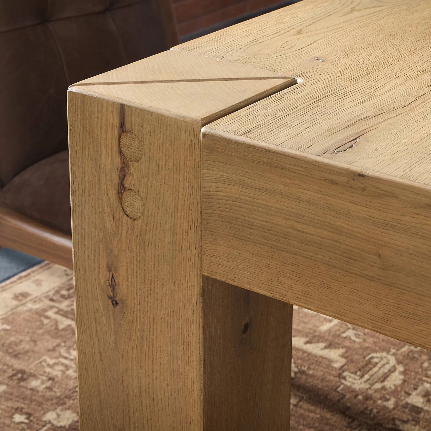 010 SI-2446545 | Closeup | Emmer Dining Table by Four Hands in aged smoked oak, aged smoked oak veneer. Made from solid oak, thick oak veneer in a transitional style.