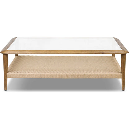 Carmelo Coffee Table by Four Hands in tempered glass, natural paper cord, medium brown oak. Made from tempered glass, rush, solid oak in a transitional style.