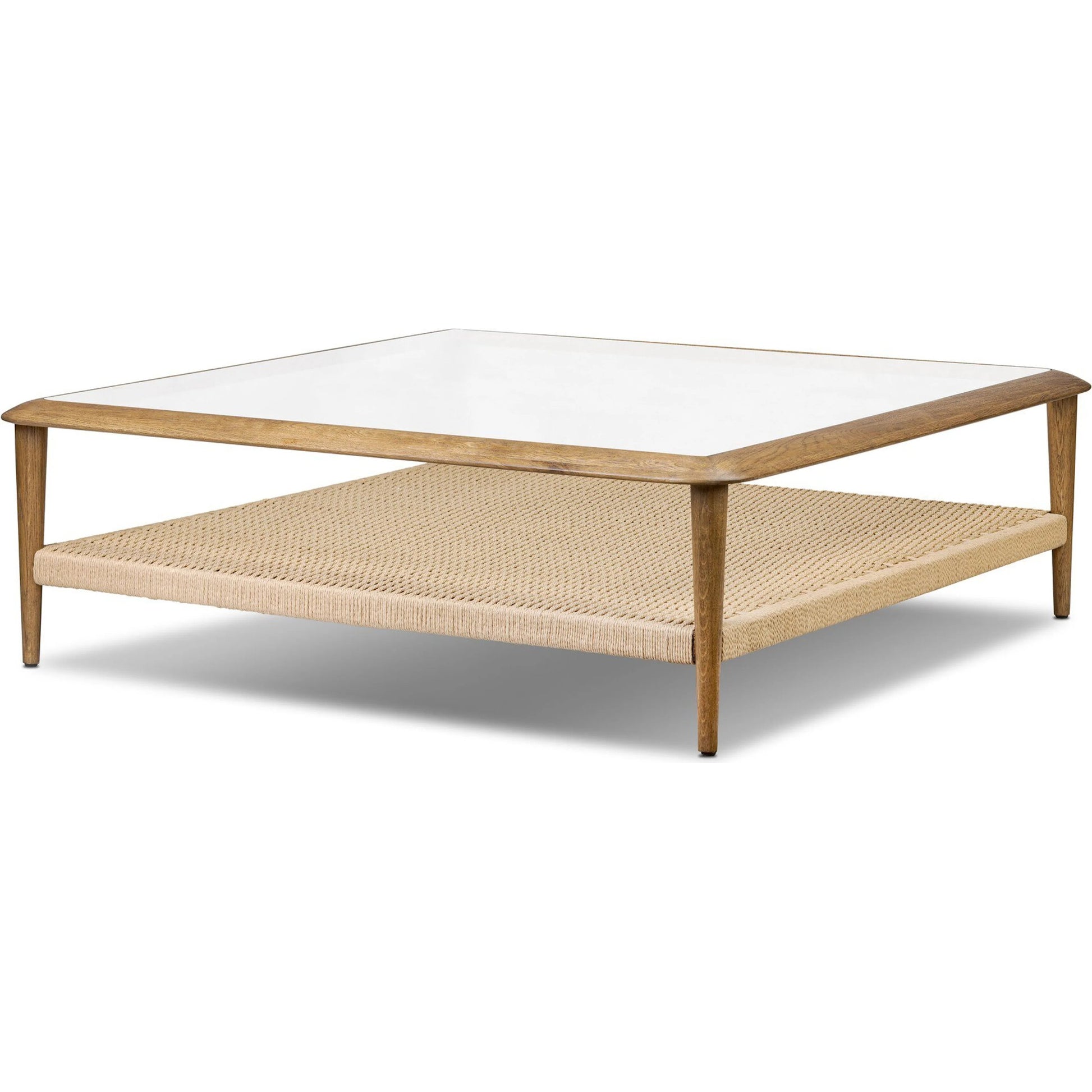 Carmelo Coffee Table by Four Hands in tempered glass, natural paper cord, medium brown oak. Made from tempered glass, rush, solid oak in a transitional style.