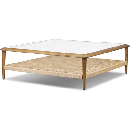 Carmelo Coffee Table by Four Hands in tempered glass, natural paper cord, medium brown oak. Made from tempered glass, rush, solid oak in a transitional style.