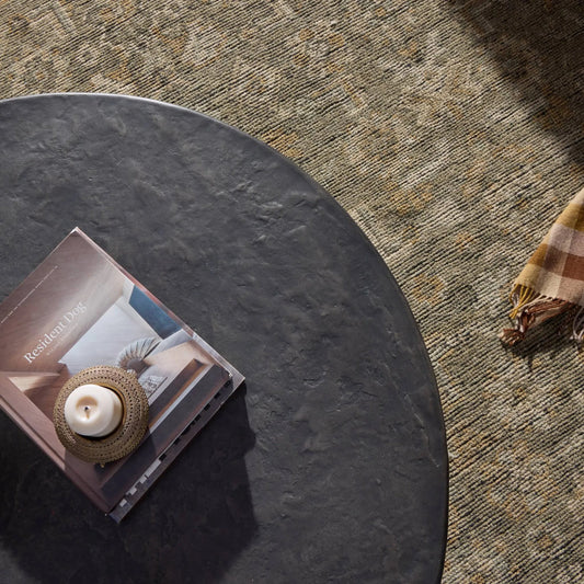 Bomba Coffee Table by Four Hands in textured black concrete. Made from solid concrete in a transitional style.