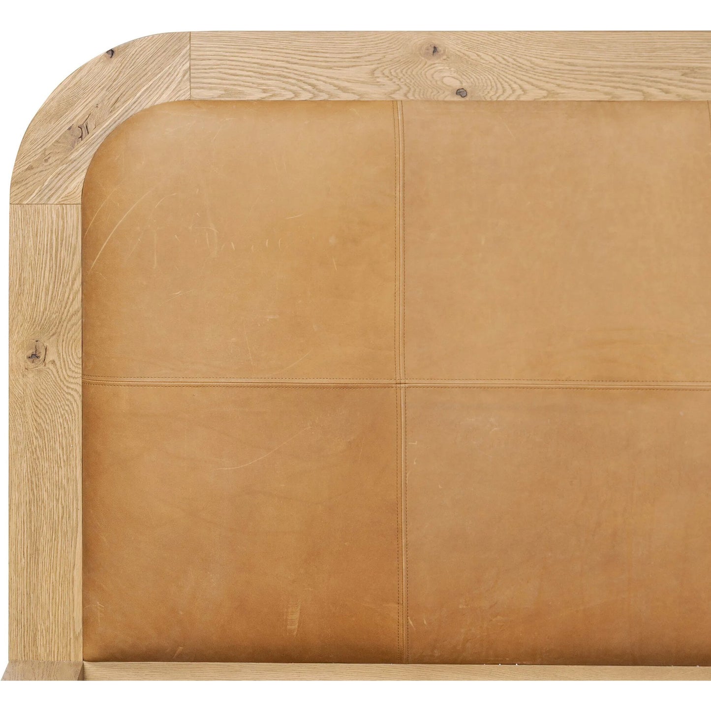 008 SI-2446644,SI-2446645 | Closeup | Rane Bed by Four Hands in heirloom sienna, honey brown oak veneer, honey brown oak. Made from top grain leather, thick oak veneer, solid oak in a transitional style.