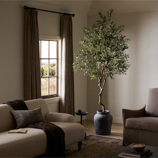 Faux Olive Tree by Four Hands in faux olive tree. Made from 55% polyvinyl chloride (pvc), 45% polyethylene in a unique style.