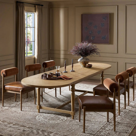 Blinn Oval Leaf Extension Dining Table by Four Hands in worn oak veneer. Made from oak veneer, solid oak in a transitional style.