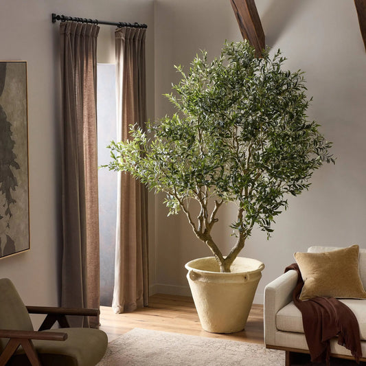 Faux Olive Tree Wide by Four Hands in faux olive tree wide. Made from 55% polyvinyl chloride (pvc), 45% polyethylene in a unique style.
