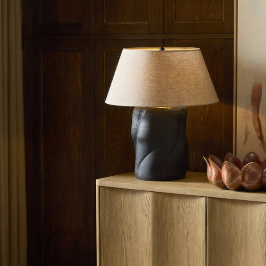 Bomba Table Lamp by Four Hands in aged black terracotta, black cord, natural linen. Made from terracotta, thermoplastic, 100% flax, linen in a unique style.