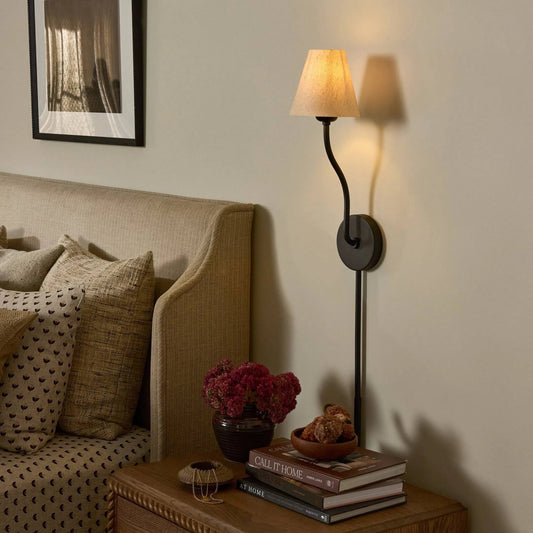 Rosaria Sconce by Four Hands in natural bronze, black cord. Made from iron, thermoplastic in a unique style.