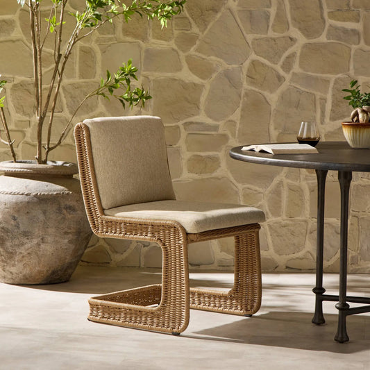 Katrine Outdoor Dining Chair by Four Hands in concha beige, textured sand. Made from 100% olefin, 100% polyethylene in a transitional style.