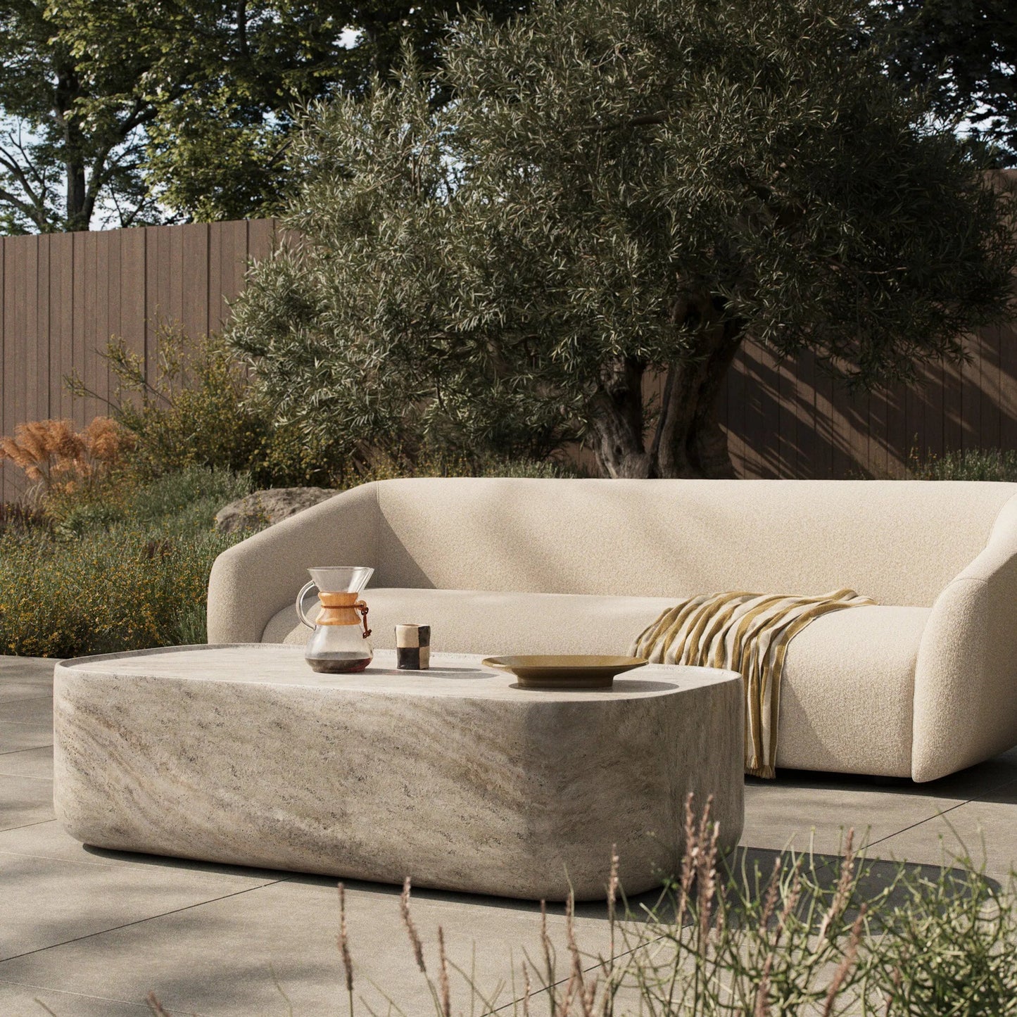 010 SI-2531659 | Lifestyle | Manor Outdoor Coffee Table by Four Hands in textured sandy grey. Made from solid concrete in a unique style.