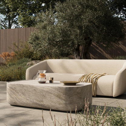 Manor Outdoor Coffee Table by Four Hands in textured sandy grey. Made from solid concrete in a unique style.