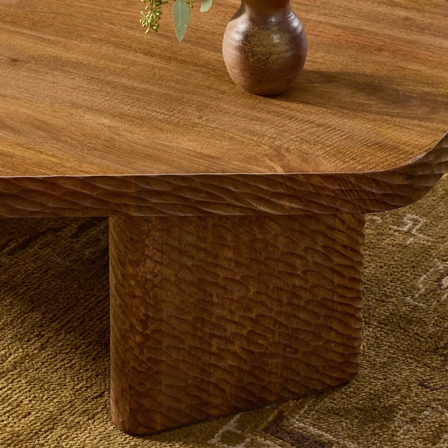 012 SI-2531669 | Closeup | Nella Coffee Table by Four Hands in warm chestnut, carved warm mango. Made from solid mango in a unique style.