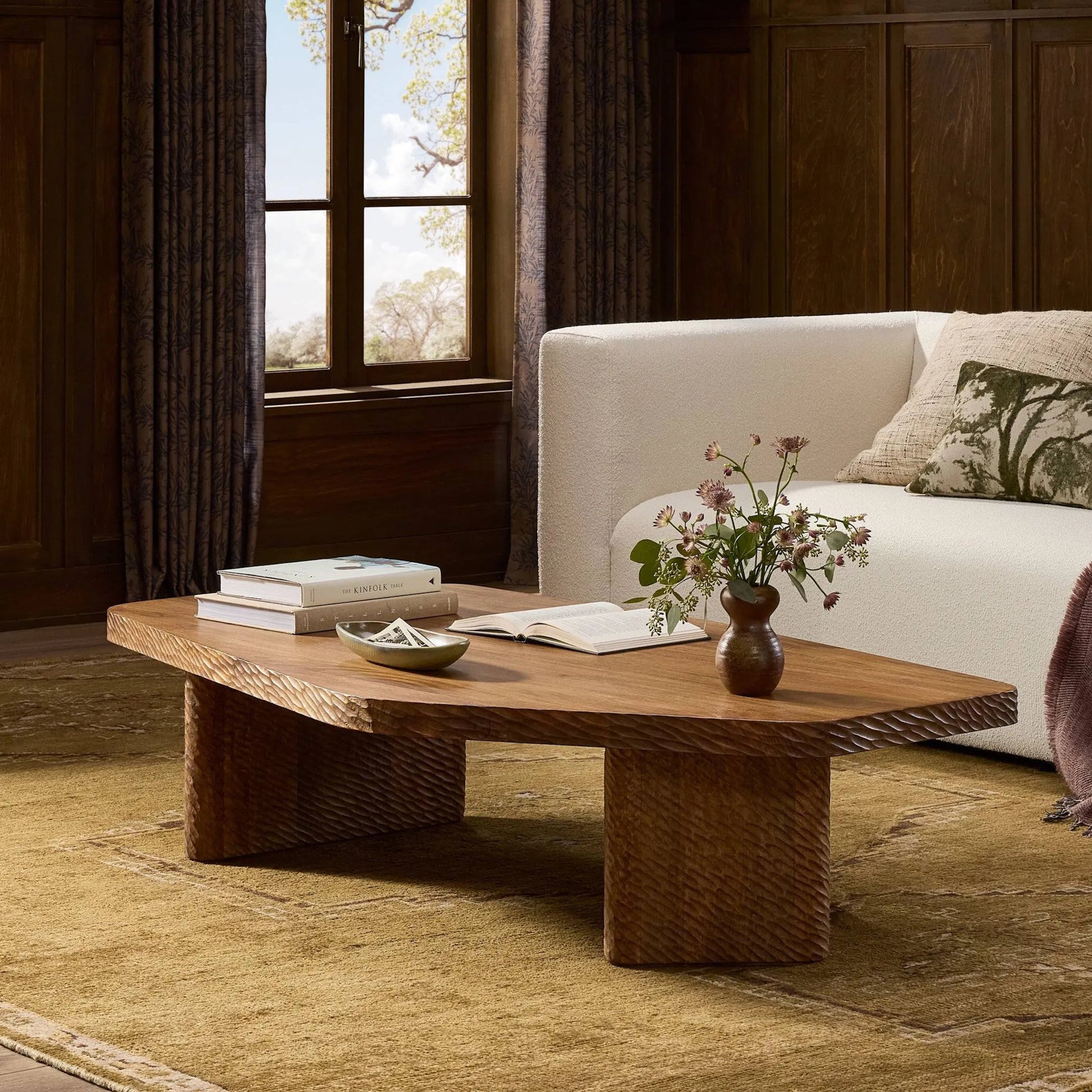 Nella Coffee Table by Four Hands in warm chestnut, carved warm mango. Made from solid mango in a unique style.