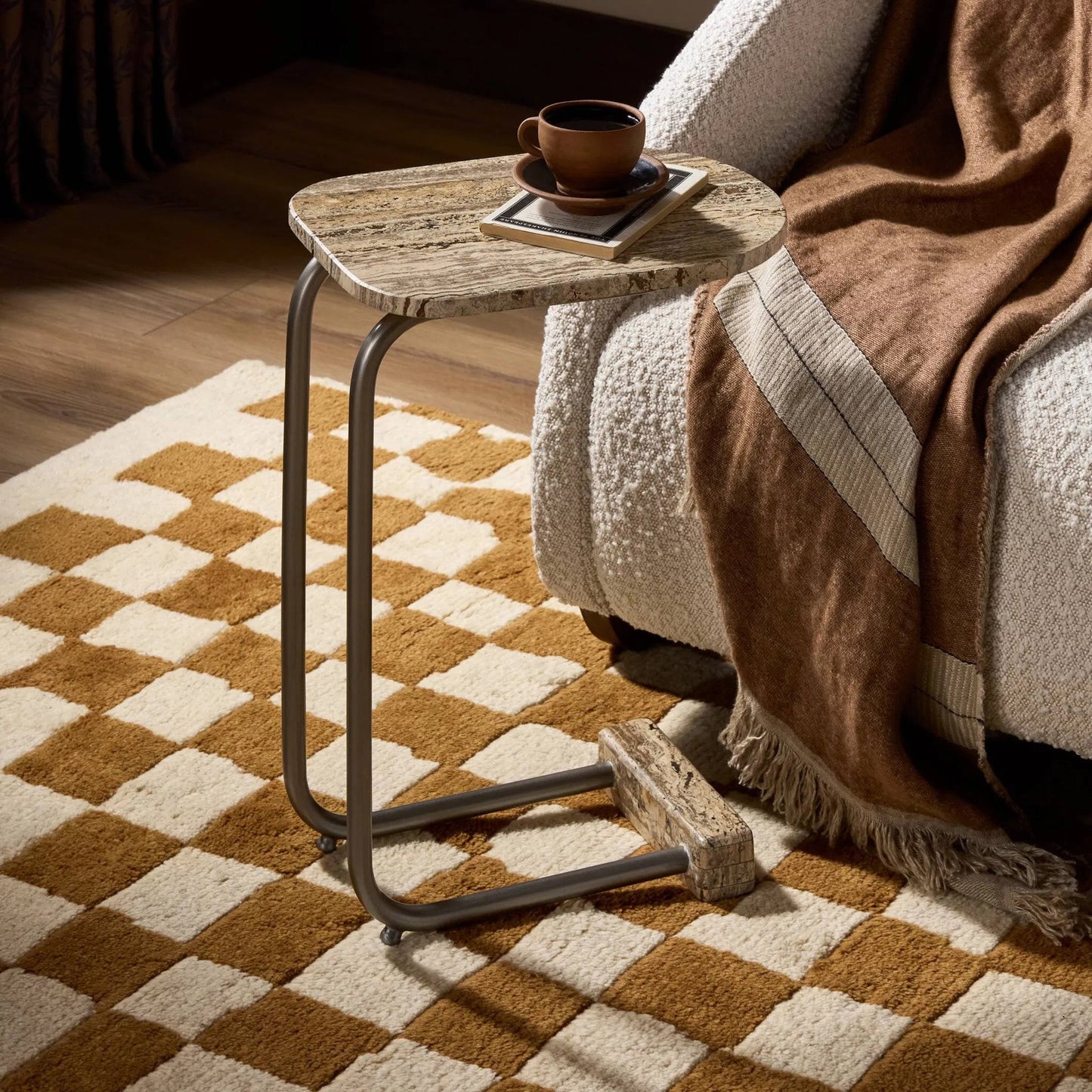012 SI-2531681 | Lifestyle | Pixie End Table by Four Hands in grey stripe travertine, light antique pewter. Made from solid travertine, iron in a unique style.