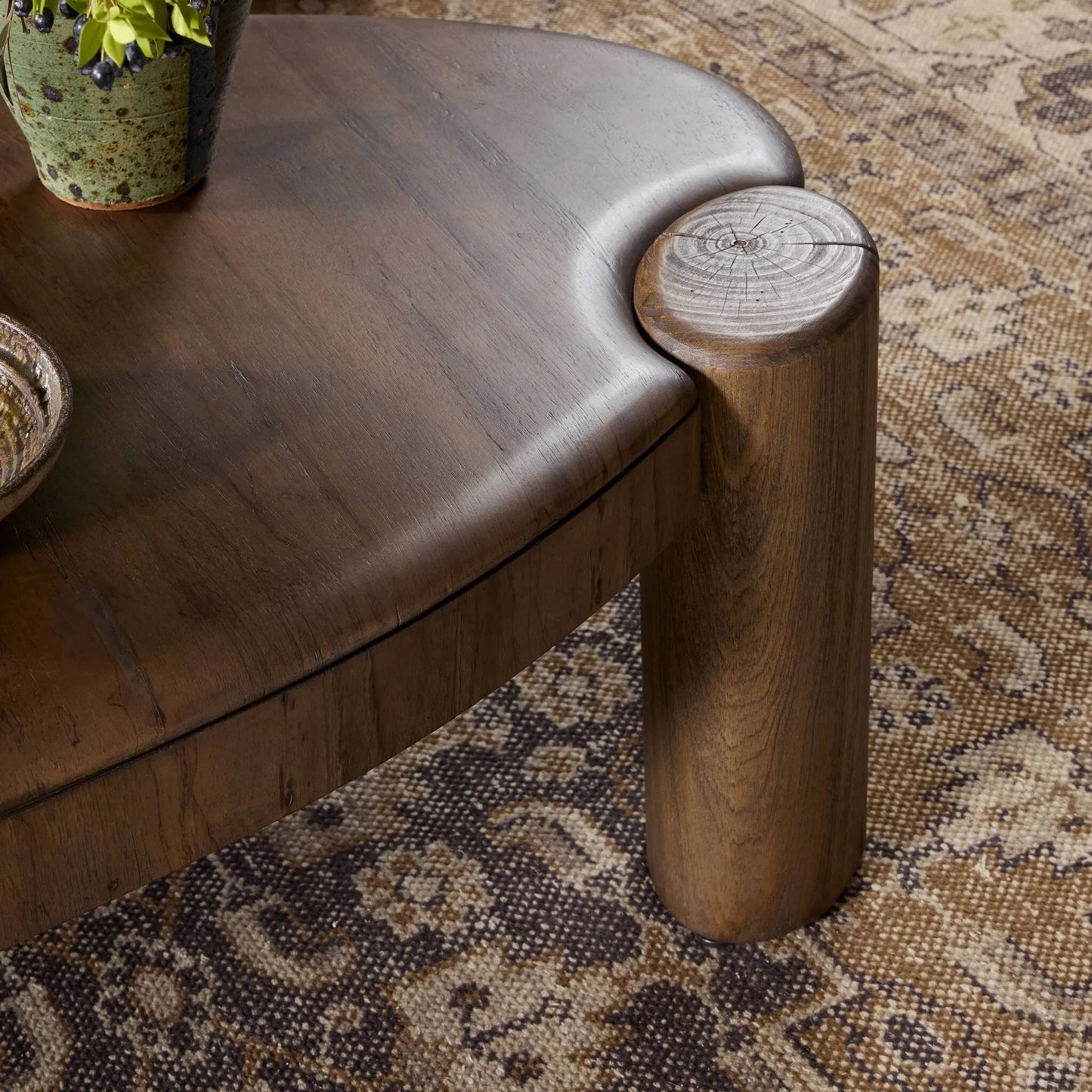 009 SI-2531644 | Closeup | Kamira Oval Coffee Table by Four Hands in dark spalted primavera, dark melina solid. Made from thick primavera veneer, melina solid in a unique style.