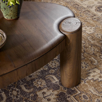 Kamira Oval Coffee Table by Four Hands in dark spalted primavera, dark melina solid. Made from thick primavera veneer, melina solid in a unique style.