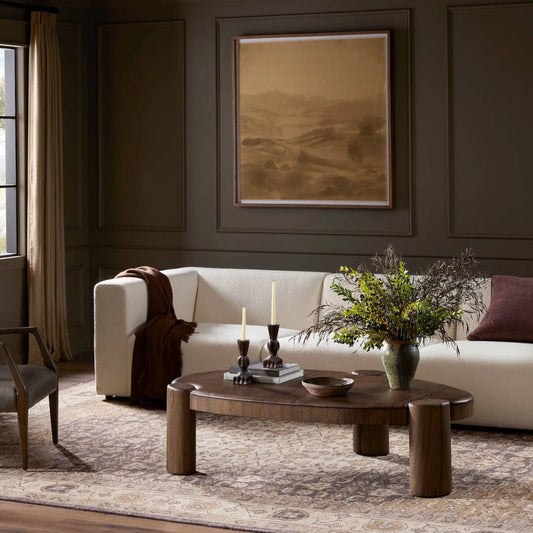 Kamira Oval Coffee Table by Four Hands in dark spalted primavera, dark melina solid. Made from thick primavera veneer, melina solid in a unique style.