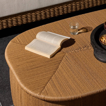 Taum Outdoor Coffee Table by Four Hands in textured sand. Made from 100% polyethylene in a unique style.