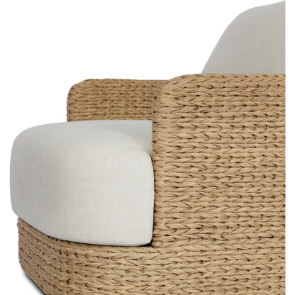 Caney Outdoor Swivel Chair by Four Hands in coastal weave, vergo cream. Made from 100% polyethylene, 100% polyester in a rustic style.