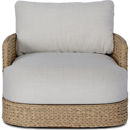 Caney Outdoor Swivel Chair by Four Hands in coastal weave, vergo cream. Made from 100% polyethylene, 100% polyester in a rustic style.