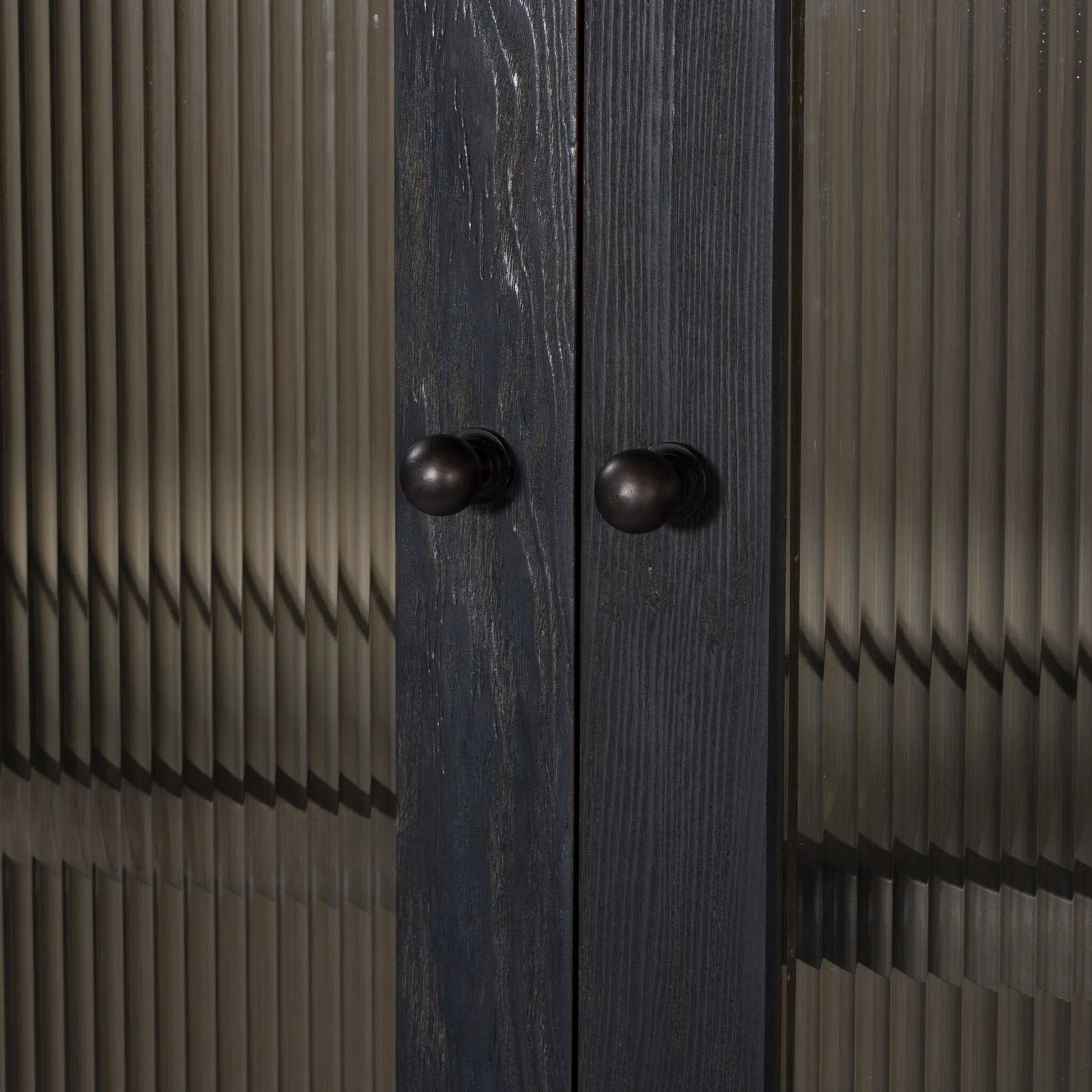 Leopold Cabinet by Four Hands in black hemlock, tempered glass, sandy hemlock. Made from hemlock solid, tempered glass in a unique style.