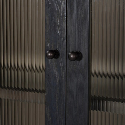 Leopold Cabinet by Four Hands in black hemlock, tempered glass, sandy hemlock. Made from hemlock solid, tempered glass in a unique style.