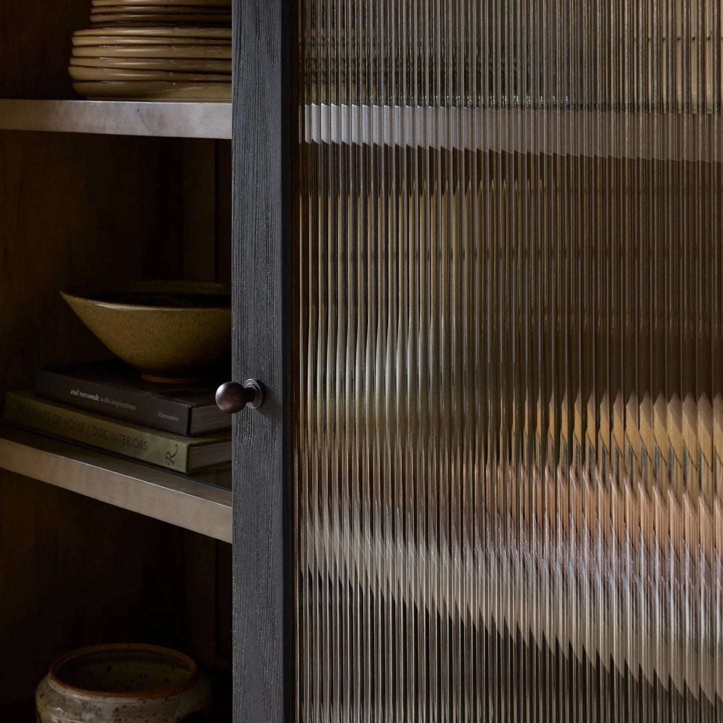 011 SI-2531655 | Closeup | Leopold Cabinet by Four Hands in black hemlock, tempered glass, sandy hemlock. Made from hemlock solid, tempered glass in a unique style.