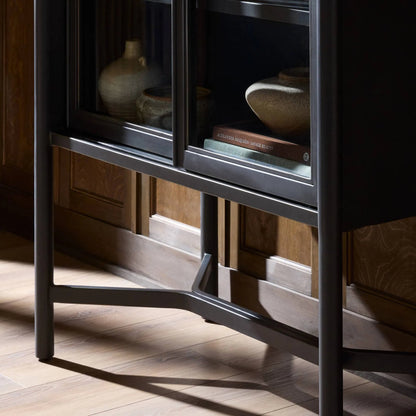 Saxon Cabinet by Four Hands in brushed bronze patina, tempered glass. Made from iron, tempered glass in a unique style.
