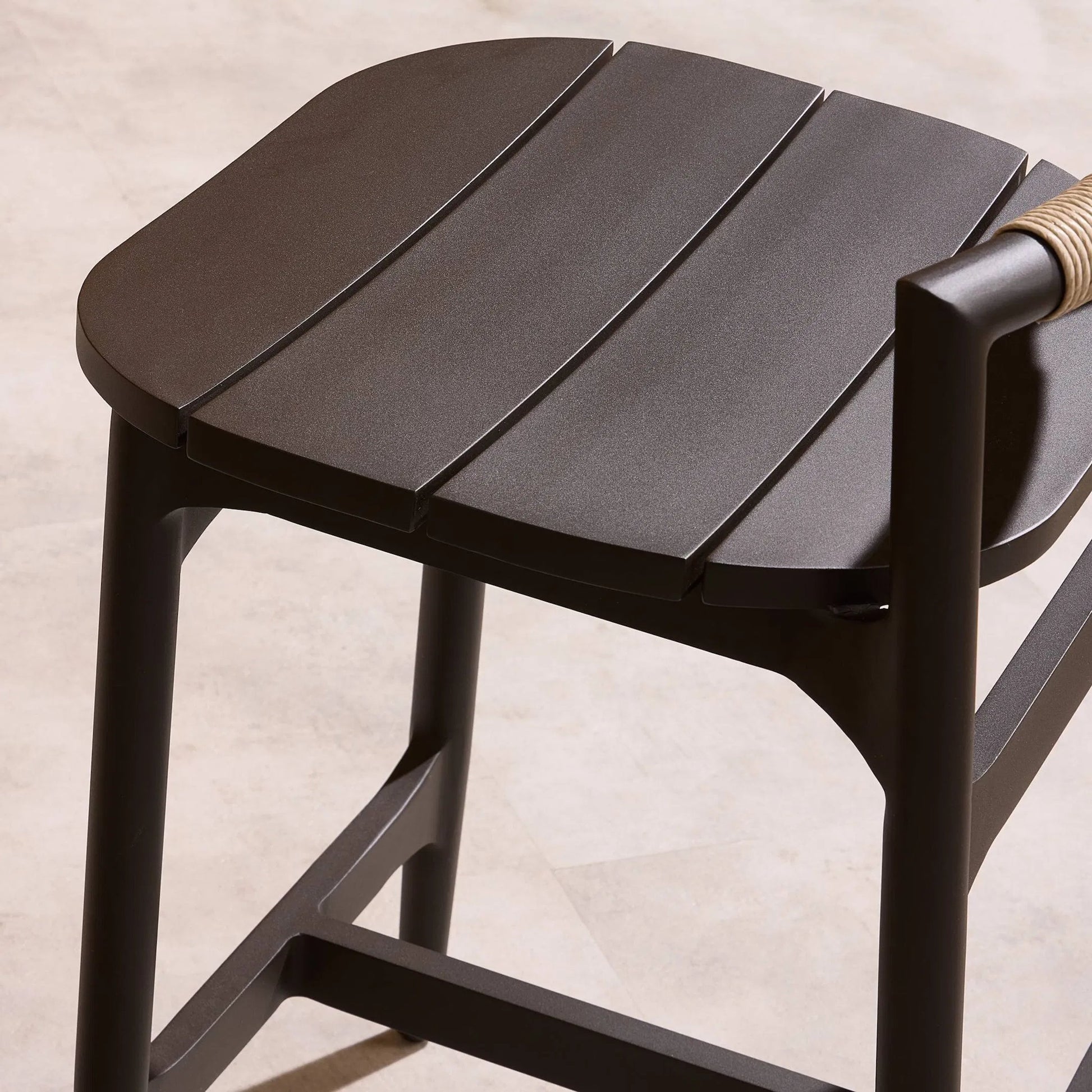 Baden Outdoor Metal Bar Stool by Four Hands in vintage white, bronze. Made from 100% polyethylene, aluminum in a unique style.