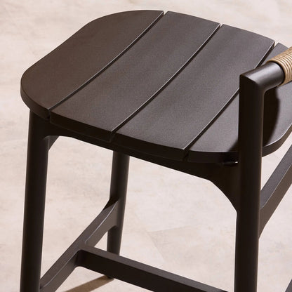 Baden Outdoor Metal Bar Stool by Four Hands in vintage white, bronze. Made from 100% polyethylene, aluminum in a unique style.