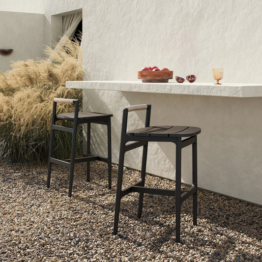 Baden Outdoor Metal Bar Stool by Four Hands in vintage white, bronze. Made from 100% polyethylene, aluminum in a unique style.
