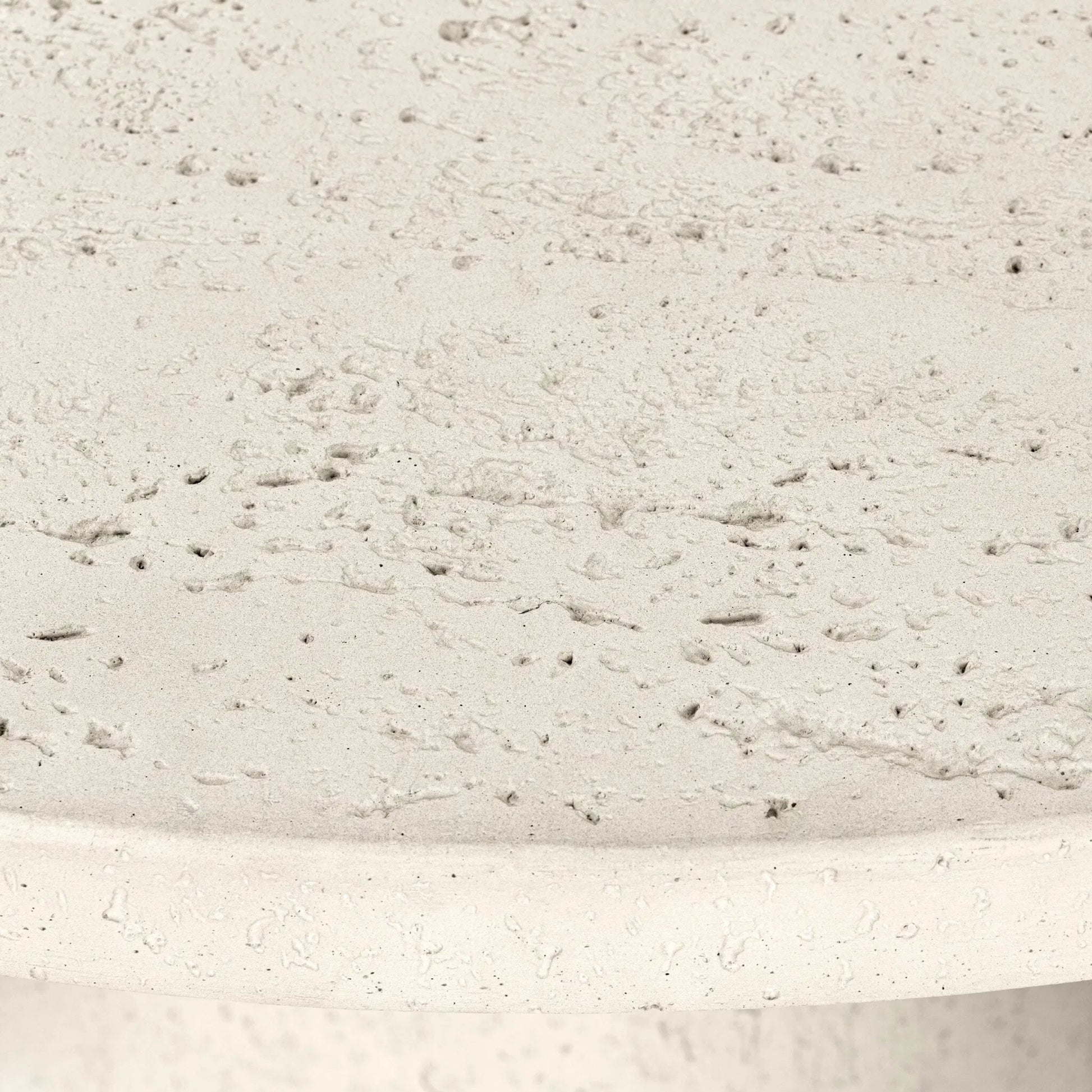 Varda Outdoor Dining Table by Four Hands in coarse ivory concrete. Made from solid concrete in a unique style.