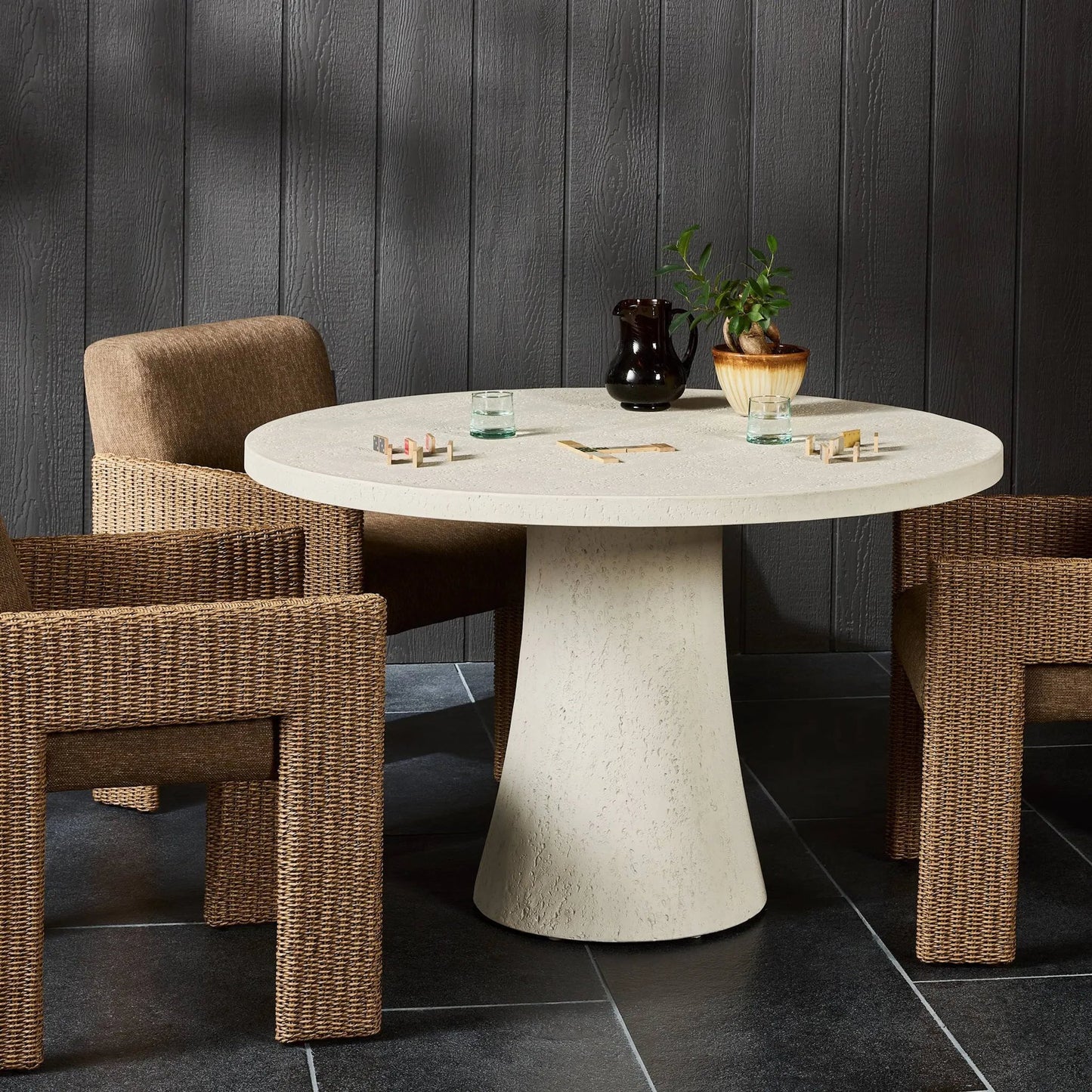012 SI-2531728 | Lifestyle | Varda Outdoor Dining Table by Four Hands in coarse ivory concrete. Made from solid concrete in a unique style.