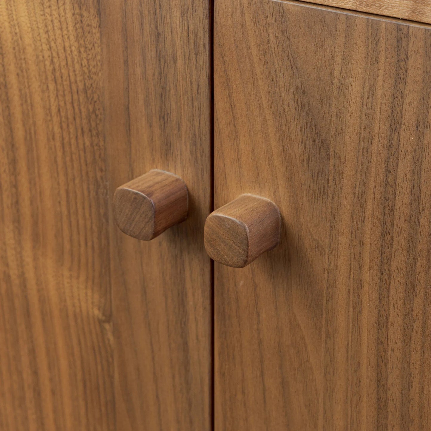 011 SI-2531577 | Closeup | Arturo 4 Door Sideboard by Four Hands in natural walnut, natural walnut veneer. Made from solid walnut, walnut veneer in a transitional style.