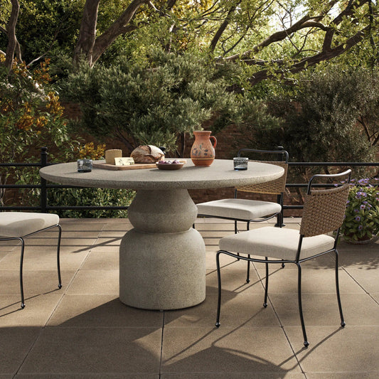 Faber Outdoor Dining Table 55" by Four Hands in aged natural concrete. Made from solid concrete in a unique style.