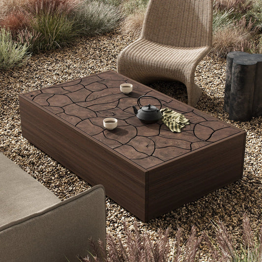 Ridge Outdoor Rectangular Coffee Table by Four Hands in stained saddle brown-teak root, stained saddle brown fsc. Made from solid teak, solid fsc®-certified teak in a unique style.