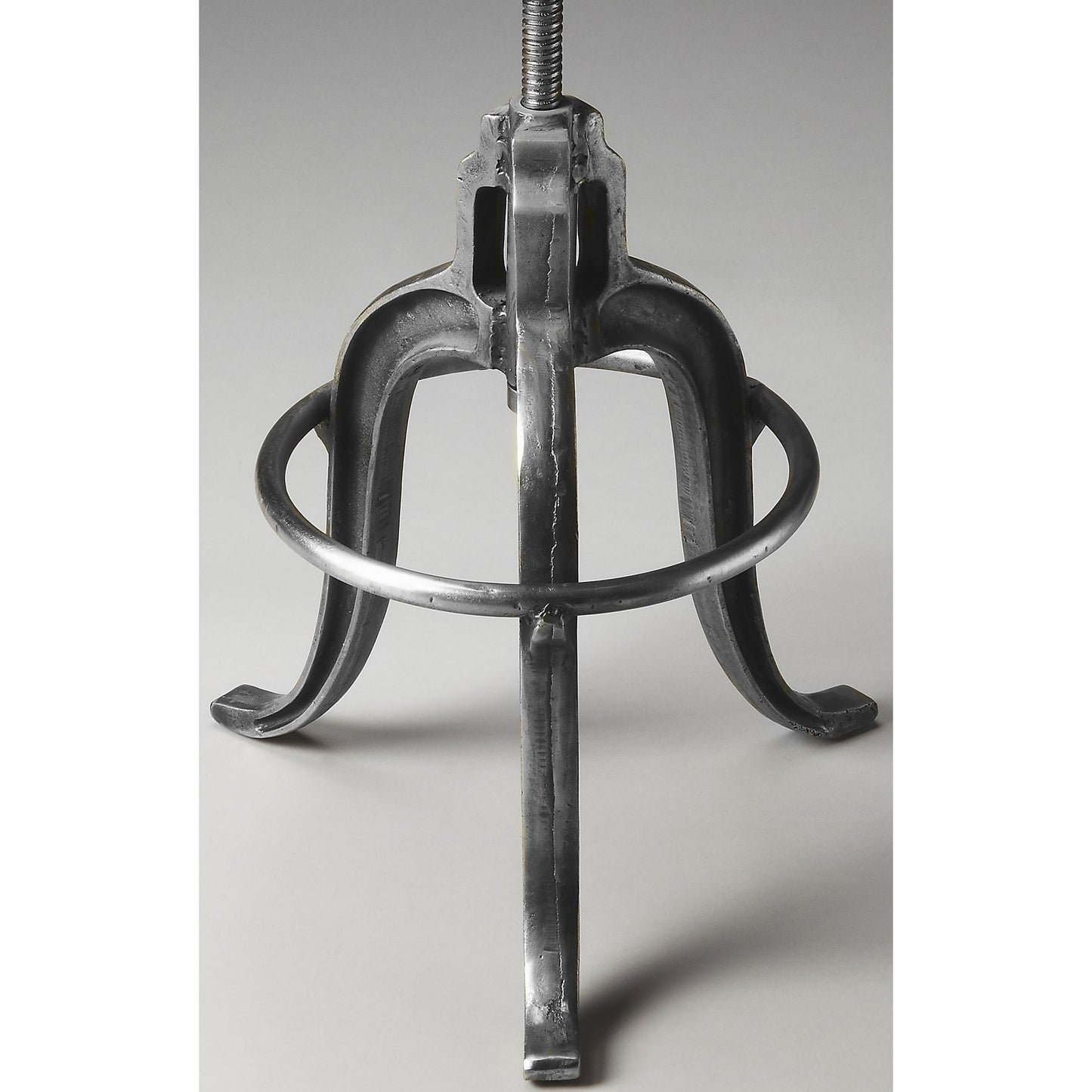 001 O-BUTLER-2542025 | Closeup | Parnell Adjustable Swivel Iron Bar Stool by Butler Specialty Company in silver and metalworks. Made from iron, steel in a modern style.